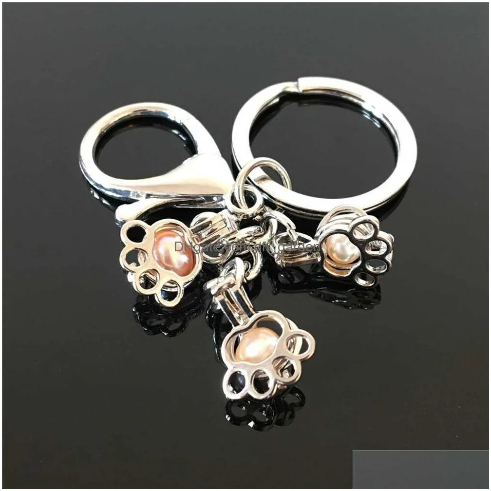 pearl cage key ring in europe and america can open keyring with hollow noctilucent volcanic stone pendant