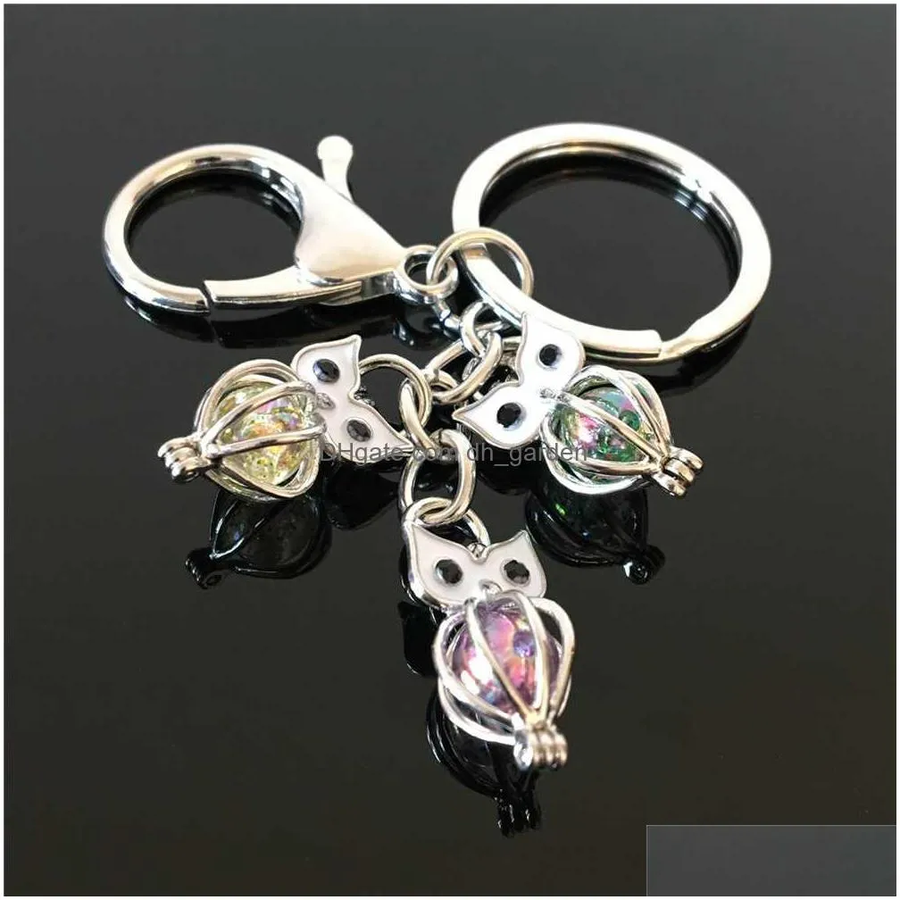 pearl cage key ring in europe and america can open keyring with hollow noctilucent volcanic stone pendant