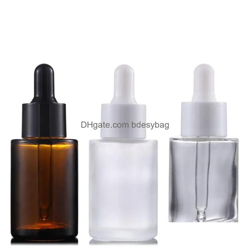 wholesale packaging bottles 30ml flat shoulder frosted clear amber glass round essential oil serum bottle with glass dropper for cosmetics essence
