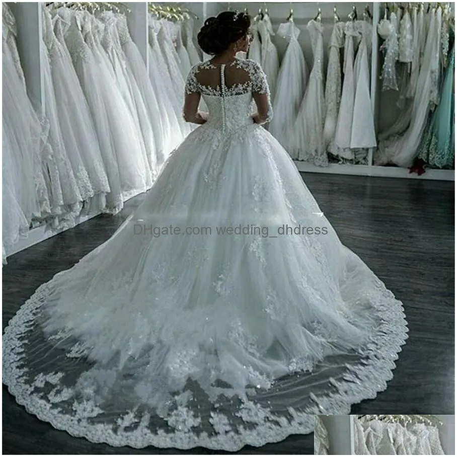 sexy see through long sleeve wedding dresses ivory sheer bling beaded lace applique jewel neck ball gowns chapel bridal gowns