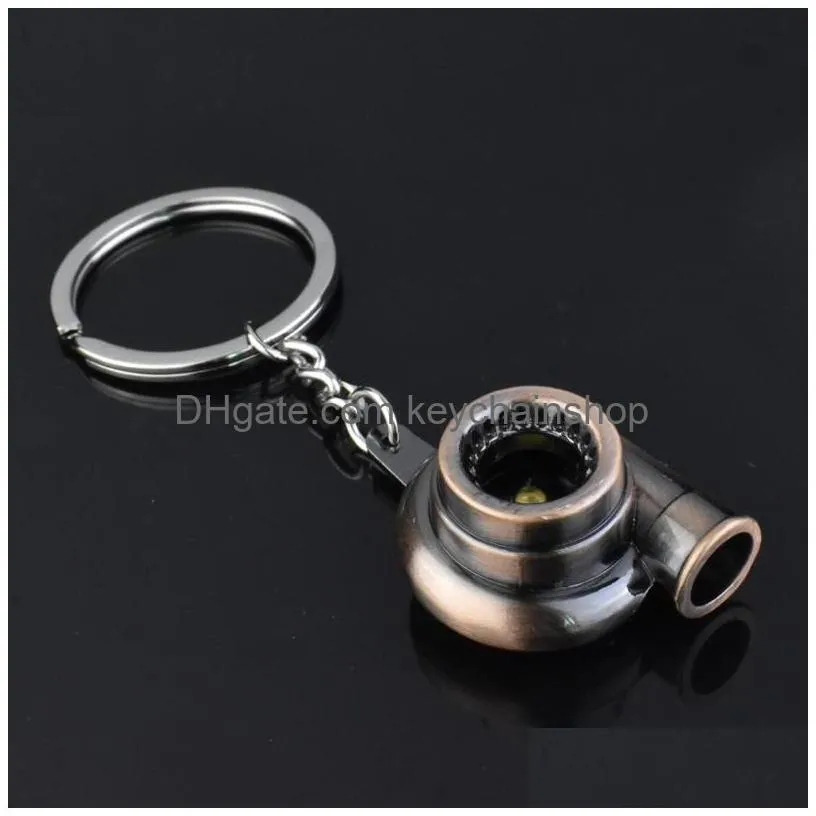 New Metal Turbo Keychain Sleeve Bearing Spinning Part Model Turbine Turbocharger Key Chain Ring 7 Colors Drop Delivery Dhcok