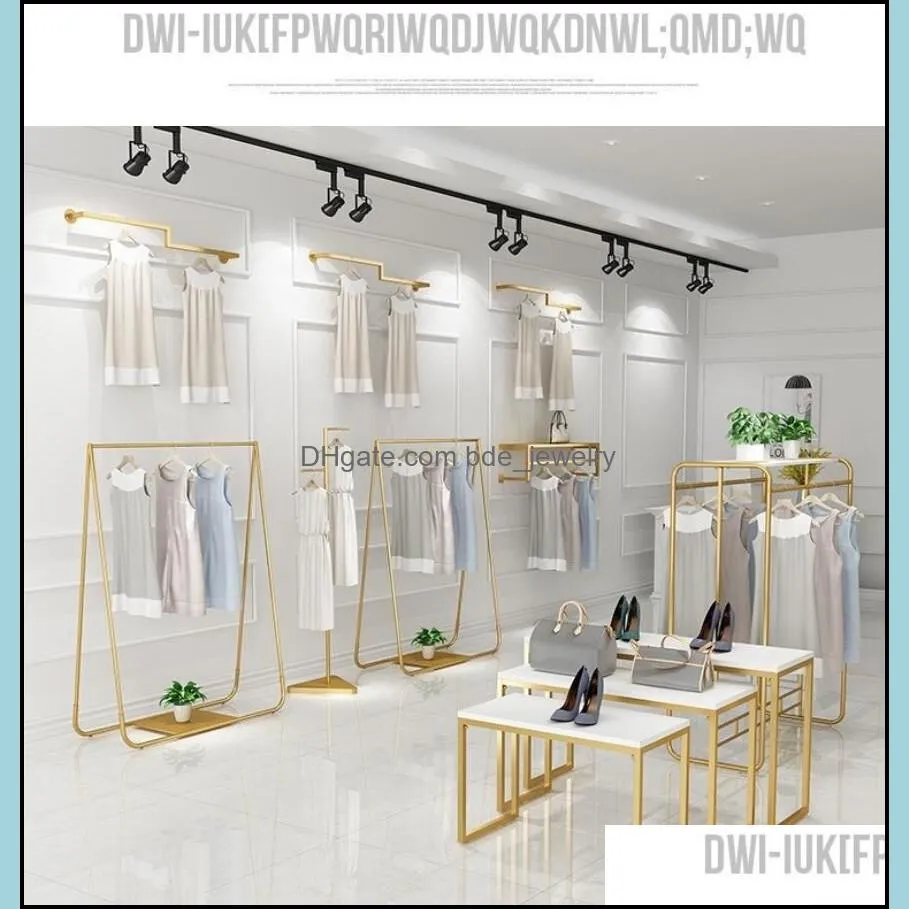 gold clothing store display rack bedroom furniture floor type womens cloth store hanger on the wall clothes racks and middle island show