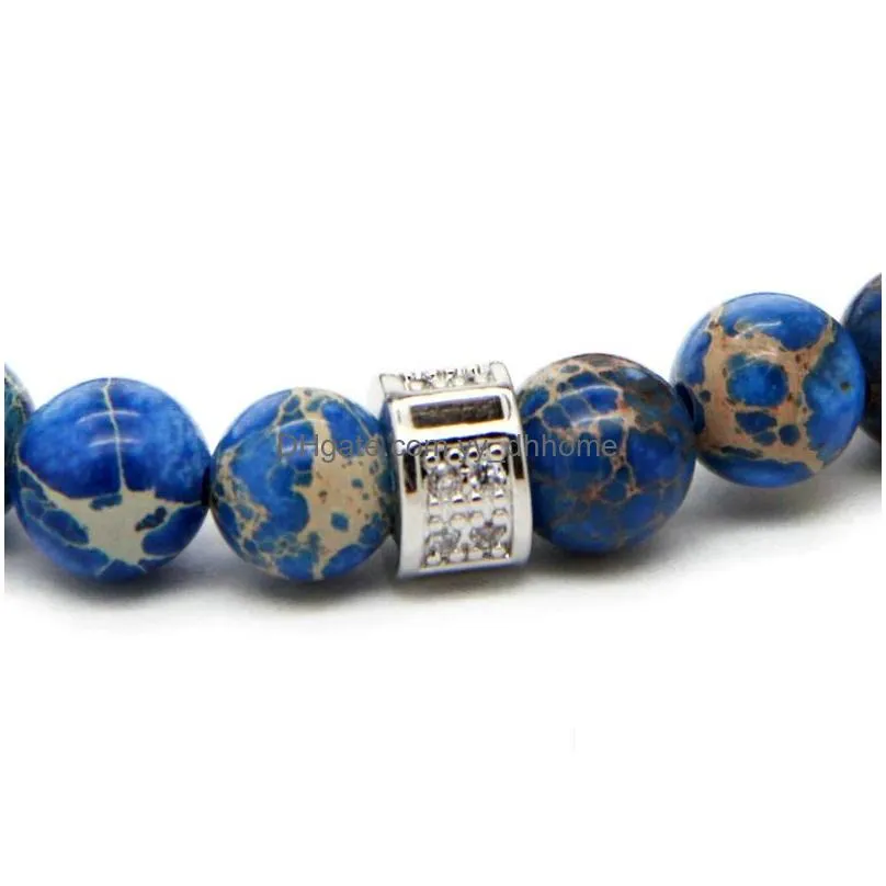  design high grade jewelry wholesale 8mm blue sea sediment stone bead with bronze gold and silver skull bracelet
