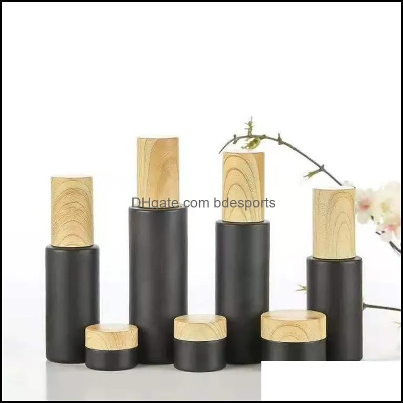 empty glass pump bottles refillable black frosted glass lotion essential oil spray bottle with woodgrain plastic cap 20ml 80ml 64 g2