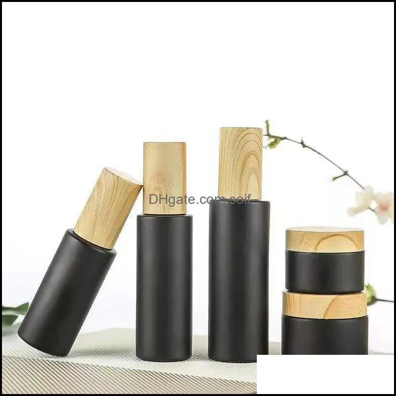 Empty glass pump bottles refillable black frosted glass lotion essential oil spray bottle with woodgrain plastic cap 20ml - 80ml 64 G2