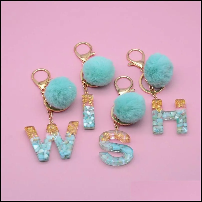 gold foil filled 26 initials letter keychain with green fluffy pompom women glitter gradient acrylic alphabet keyring
