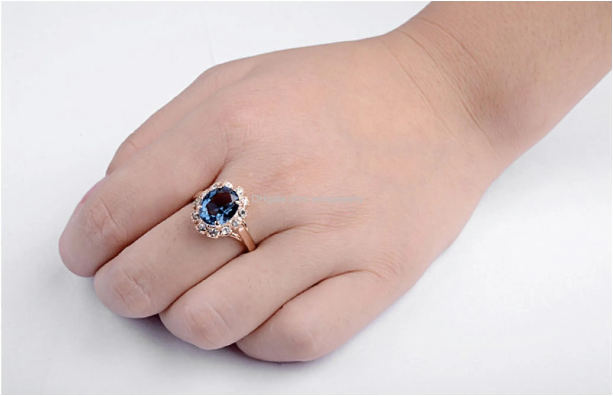 rose gold plated oval shaped gem style ring with sapphire blue swarovski element crystal and clear round shaped cubic zirconia fashion jewelry for women