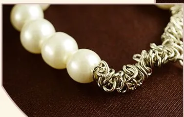 Il nuovo braccialetto di vendita caldo dell'arco del braccialetto della perla del braccialetto della nuova di Fashions di vendita calda della perla libera il trasporto con il numero di inseguimento