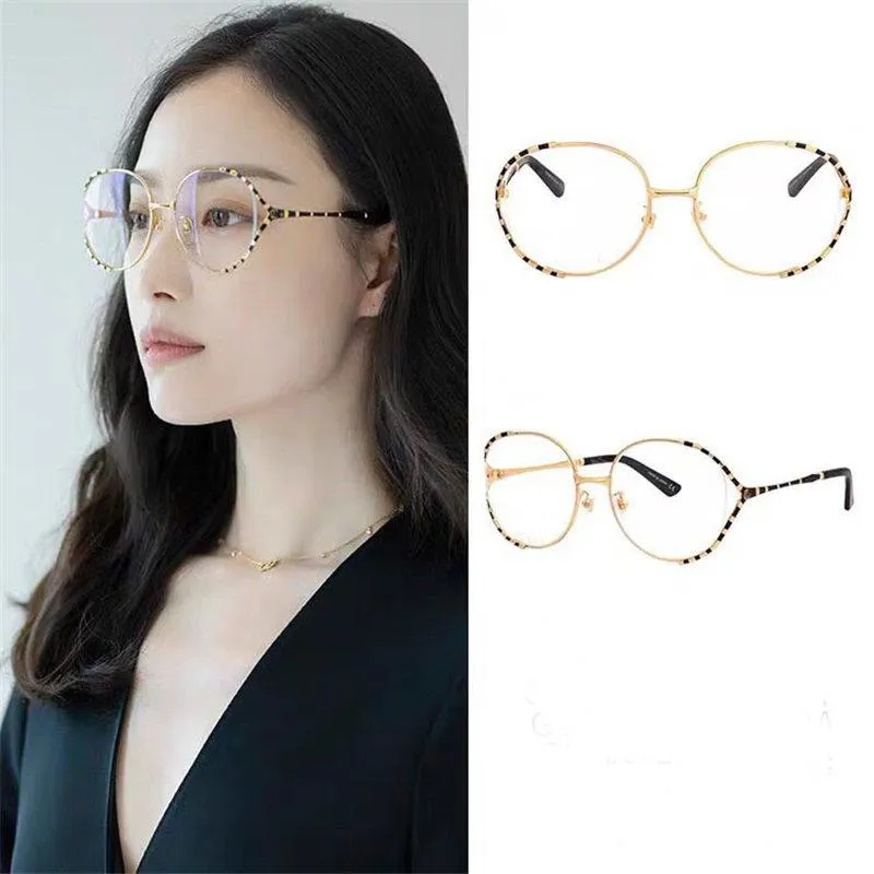 New fashion designer optical glasses 0596 large frame hollow metal frame popular style top quality HD clear lens300x