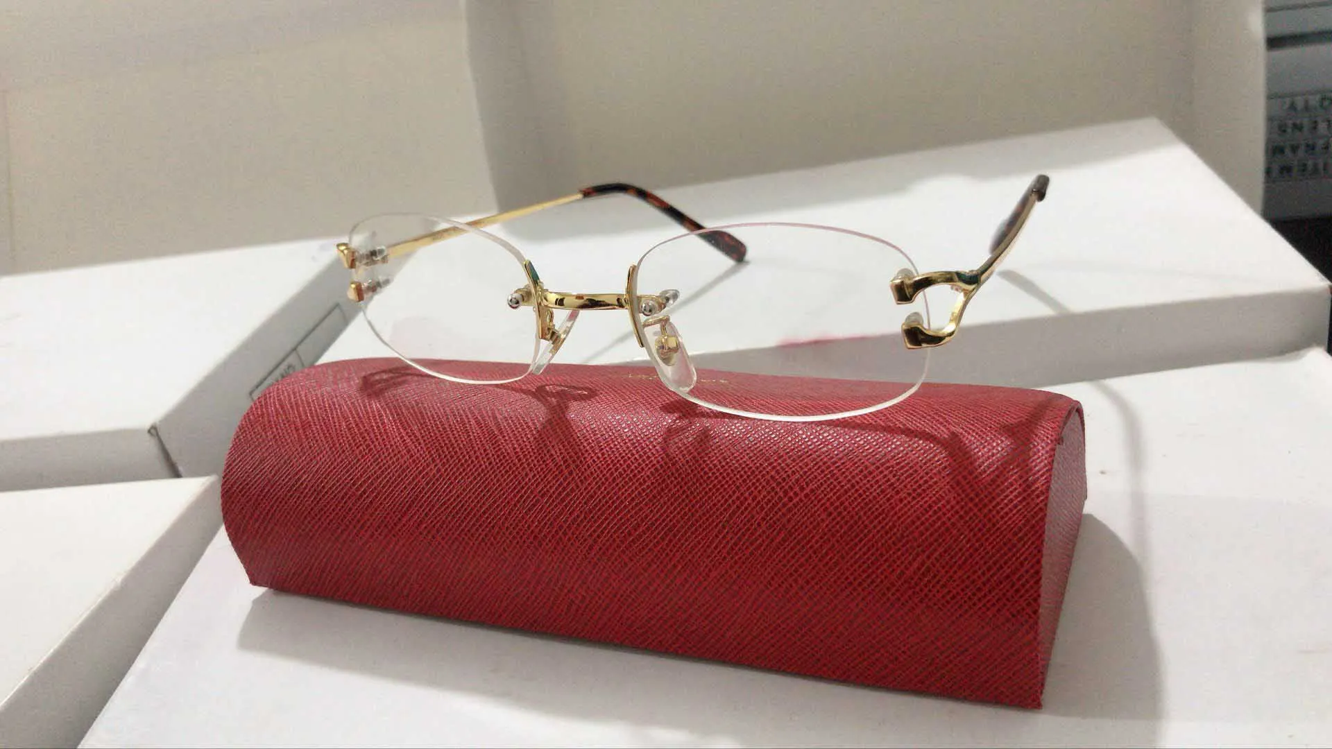 Whole-Fashion Sun Glasses Eyeglass Rimless Frames Optical Sunglasses Metal Legs Frame Brand Designer Glasses With Case and Box2233