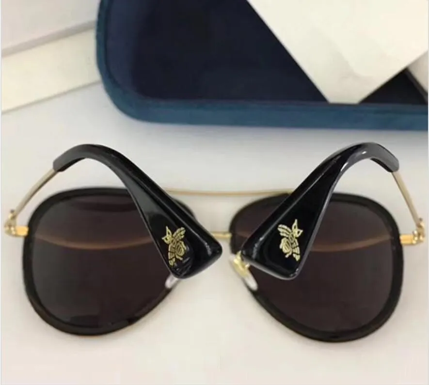 Occhiali da sole di design di lusso donne 0062 classici occhiali in metallo in metallo in stile moda estiva
