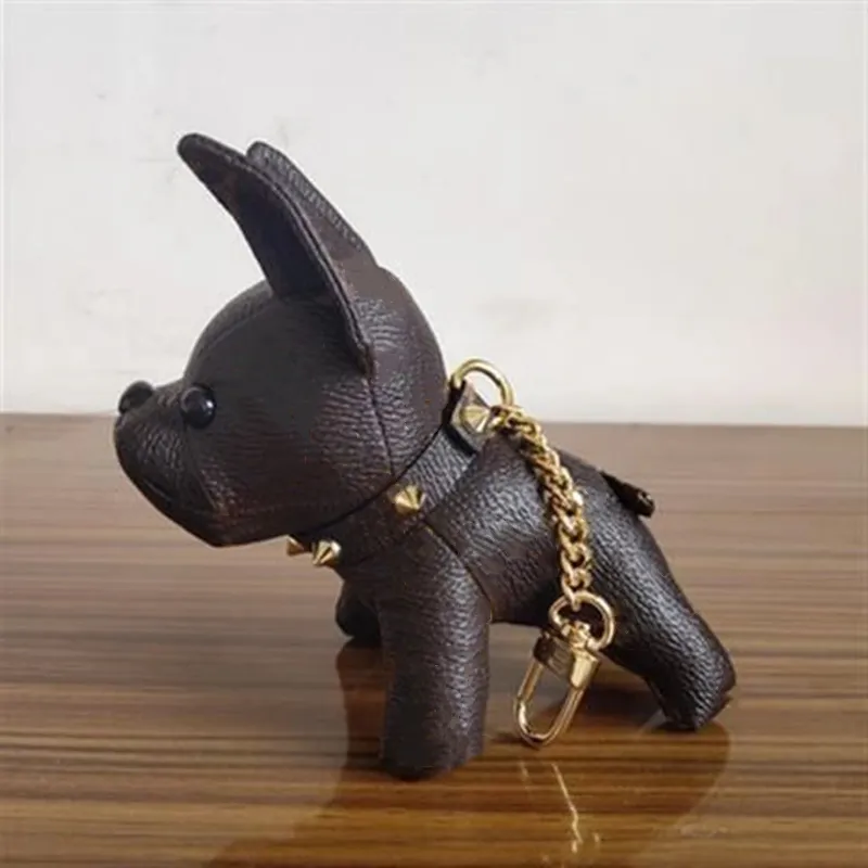 Nyaste unisex designer nyckelchain handväska hängande väskor hund design bilar kedjor nyckelringar för kvinnliga gåvor läder läder hög kvalitet keyc211m