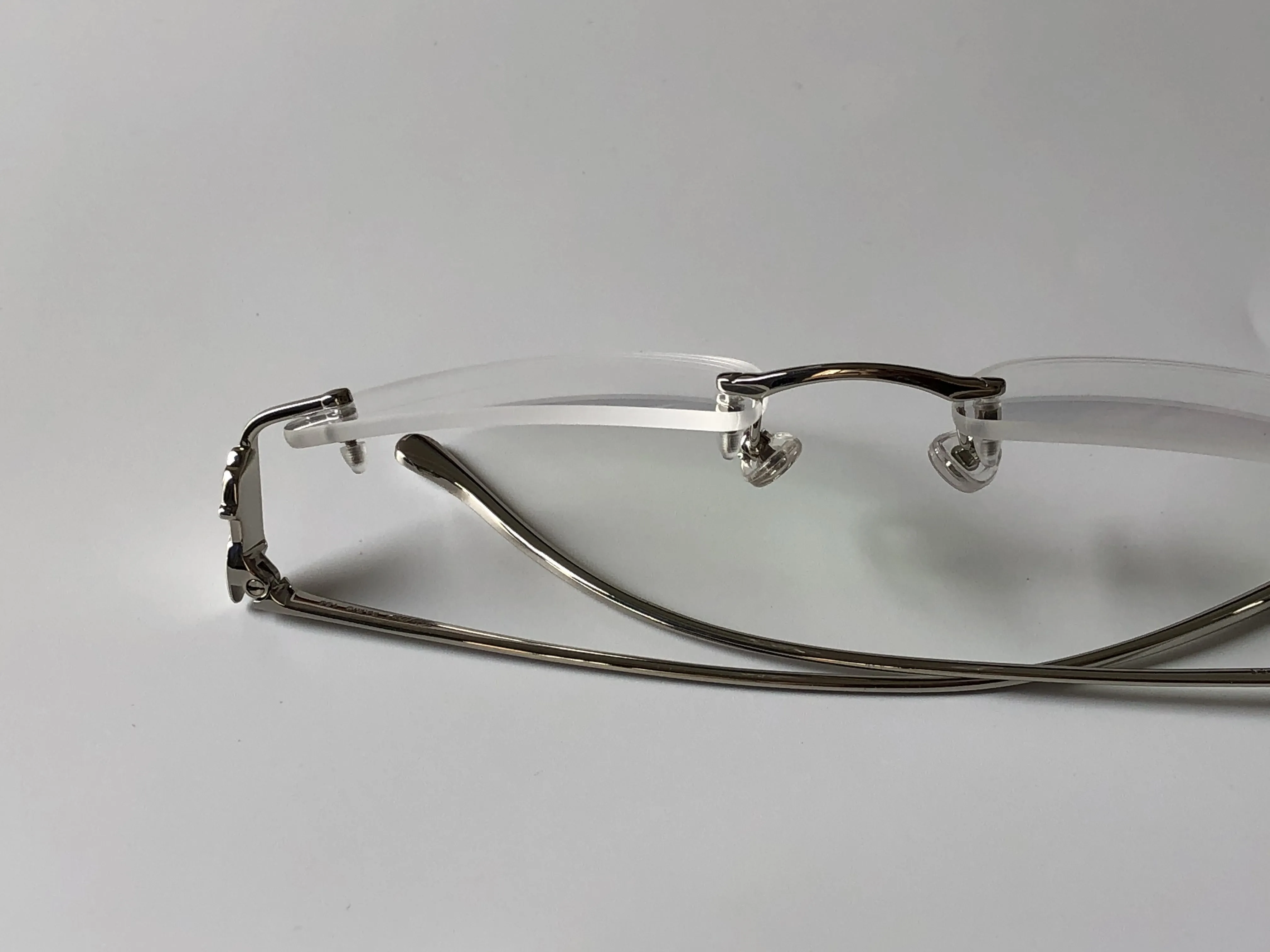 まったく新しいファッションデザインフレーム光学メガネ5634295レトロメタルフレームレス透明レンズ動物の脚ビンテージクラシッククレア270R