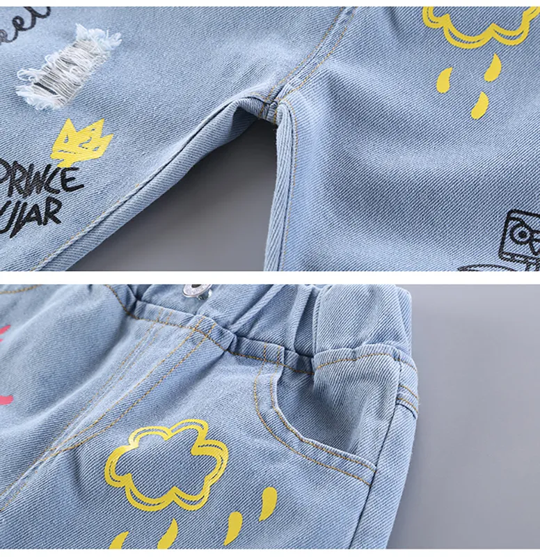 Barnflicka jeans blommig tecknad långa byxor vårhöst graffiti målning tryck avslappnade byxor med hole jyf 220222331m6413045