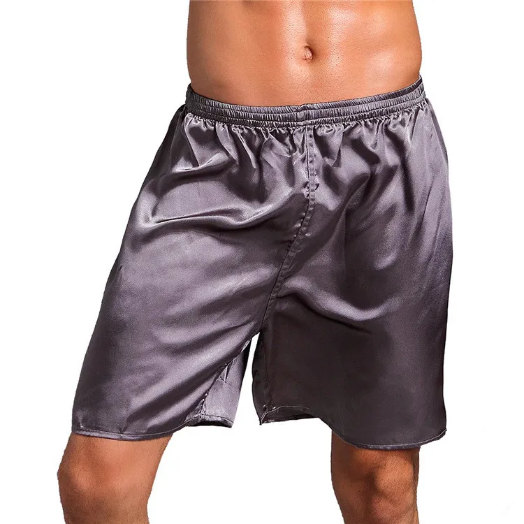 Mężczyźni rozciągają talię cienkie luźne bokserki piżama spodnie spodnie solidny kolor miękki jedwabny krótkie spodnie męskie ubrania