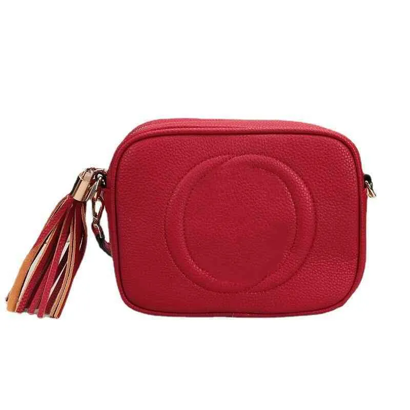 Women's camera bag style solid color litchi pattern horizontal square zipper Single Shoulder Messenger Bag254g