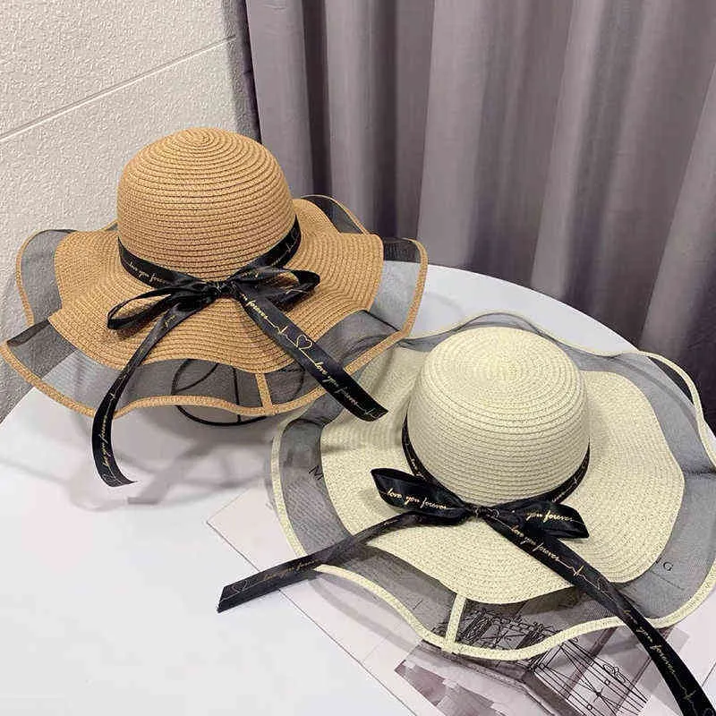 Cappelli estivi donna Visiera parasole in paglia Tesa larga Pieghevole Cappello da spiaggia da donna Cappellino protezione solare Cappellino con fiocco femminile Cappello moda donna G220301