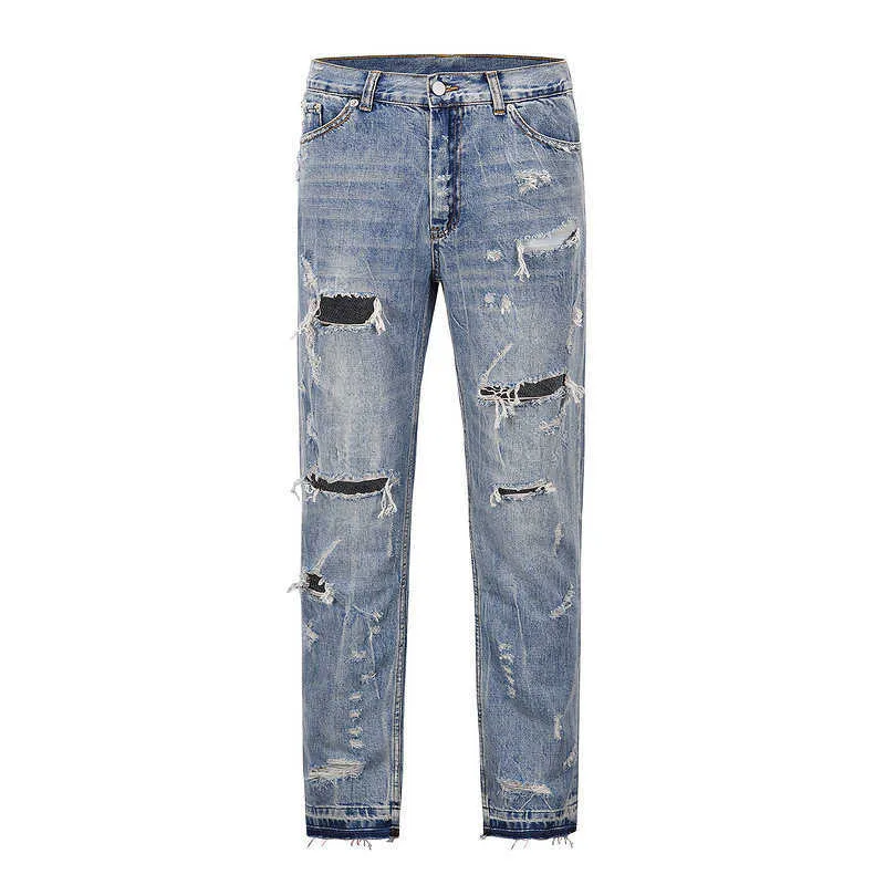 Jeans de hombre High street ins mismo estilo hip-hop jeans perforados con barba de gato