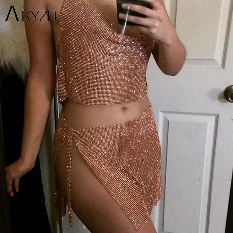 AKYZO mujeres brillante sexy conjunto de dos piezas de corte bajo sin mangas halter backless fiesta top split imperio mini falda 220302