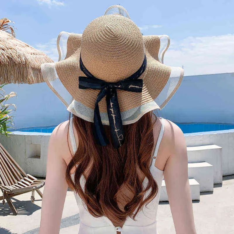 Cappelli estivi donna Visiera parasole in paglia Tesa larga Pieghevole Cappello da spiaggia da donna Cappellino protezione solare Cappellino con fiocco femminile Cappello moda donna G220301