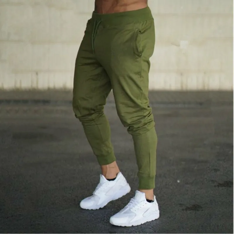 Mode nouveaux hommes Joggers marque mâle pantalon pantalons décontractés pantalons de survêtement survêtement gris décontracté élastique coton gymnases Fitness entraînement pan WE