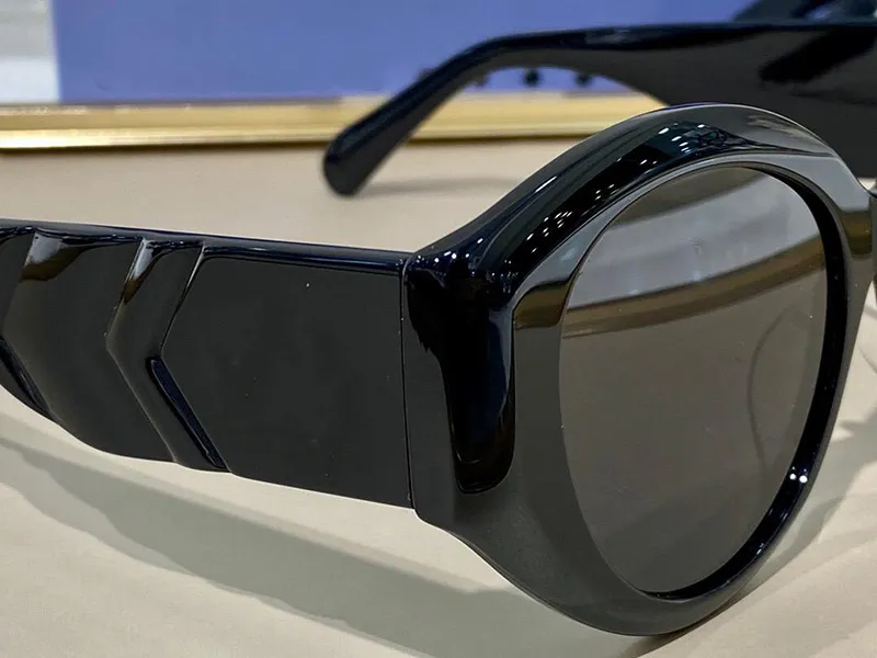 0809 Nuevas gafas de sol de moda Gogas de marco de ojo de gato Mujeres Estilo popular de alta calidad UV 400 Protección de alta calidad con el caso 0247N