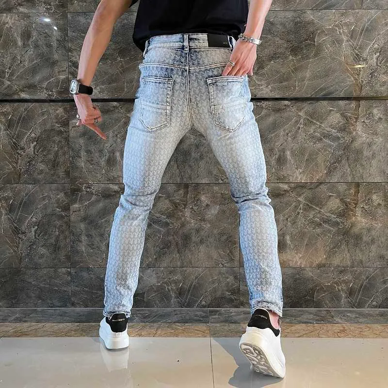 Jeans da uomo Autunno nuovo marchio di moda di alta moda testa di coniglio jeans da uomo con stampa completa lavati e fatti vecchi leggings con barba di gatto