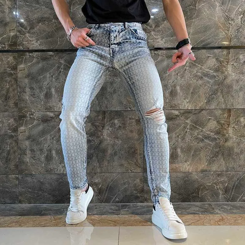 Jeans pour hommes Automne nouvelle marque de mode de rue haute tête de lapin pleine impression jeans pour hommes lavés et fabriqués vieux trou chat barbe leggings