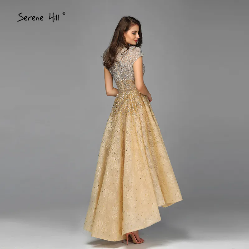 Robes de soirée asymétriques de luxe à col haut doré 2020 perles paillettes robes de soirée sans manches Serene Hill LJ201125