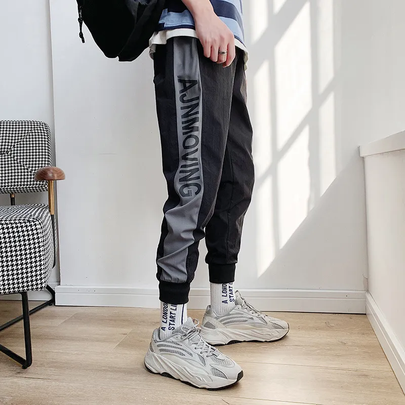 Новый хип-хоп Streetwear Мужская сращивание Joggers Брюки мода повседневные грузовые брюки брюки брюки Gareman Pant Men Student Discount 201110