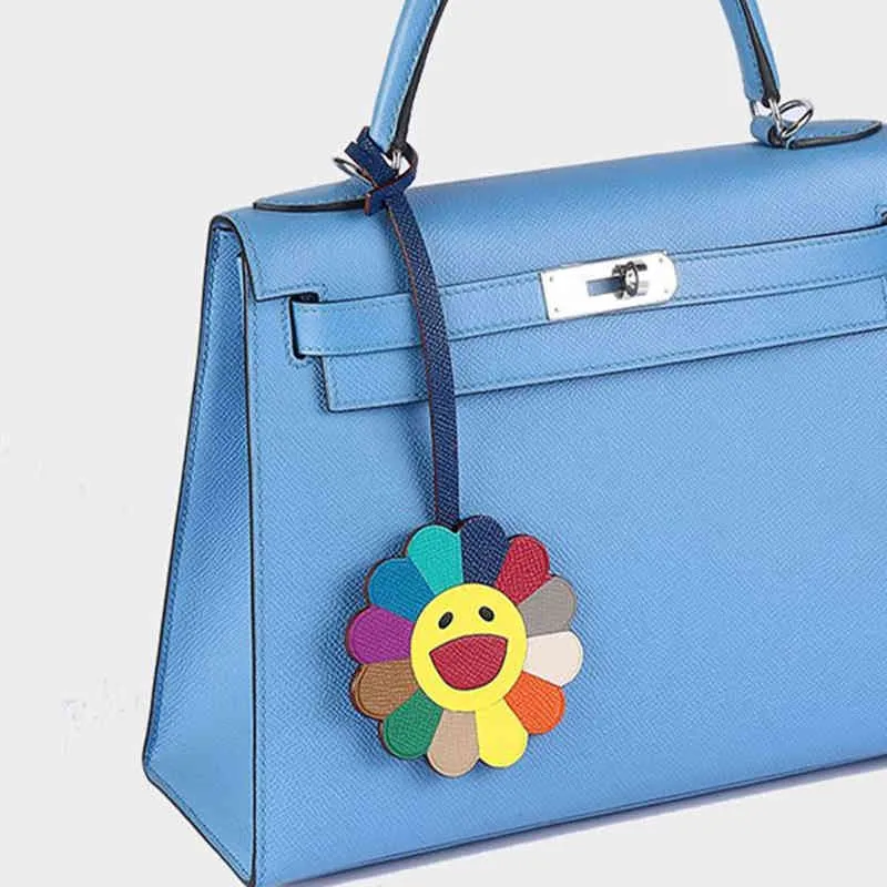 Marchio Borsa da sole Fascino Portachiavi in vera pelle di mucca Fiore di colore Borsa Ornamento Ciondolo auto di moda Accessorio da donna Top1080382