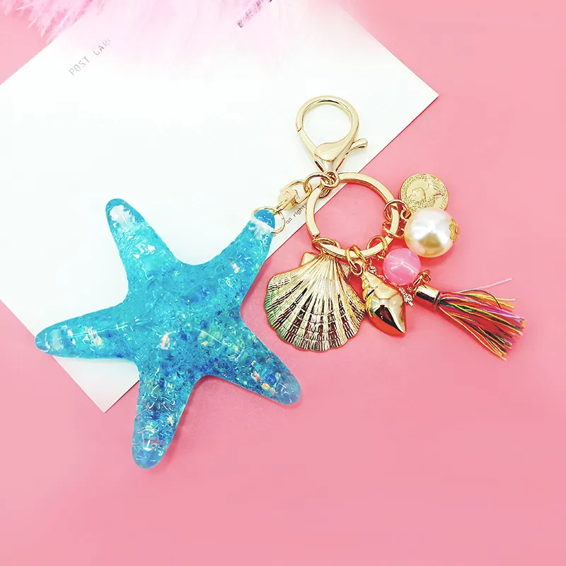 Neue Fantasie Cartoon Sea World Pearl Shell Starfish Keychain Pentagram Kristall Schlüsselanhänger Damen Tasche Auto Key Legierung Anhänger Schmuck J0306