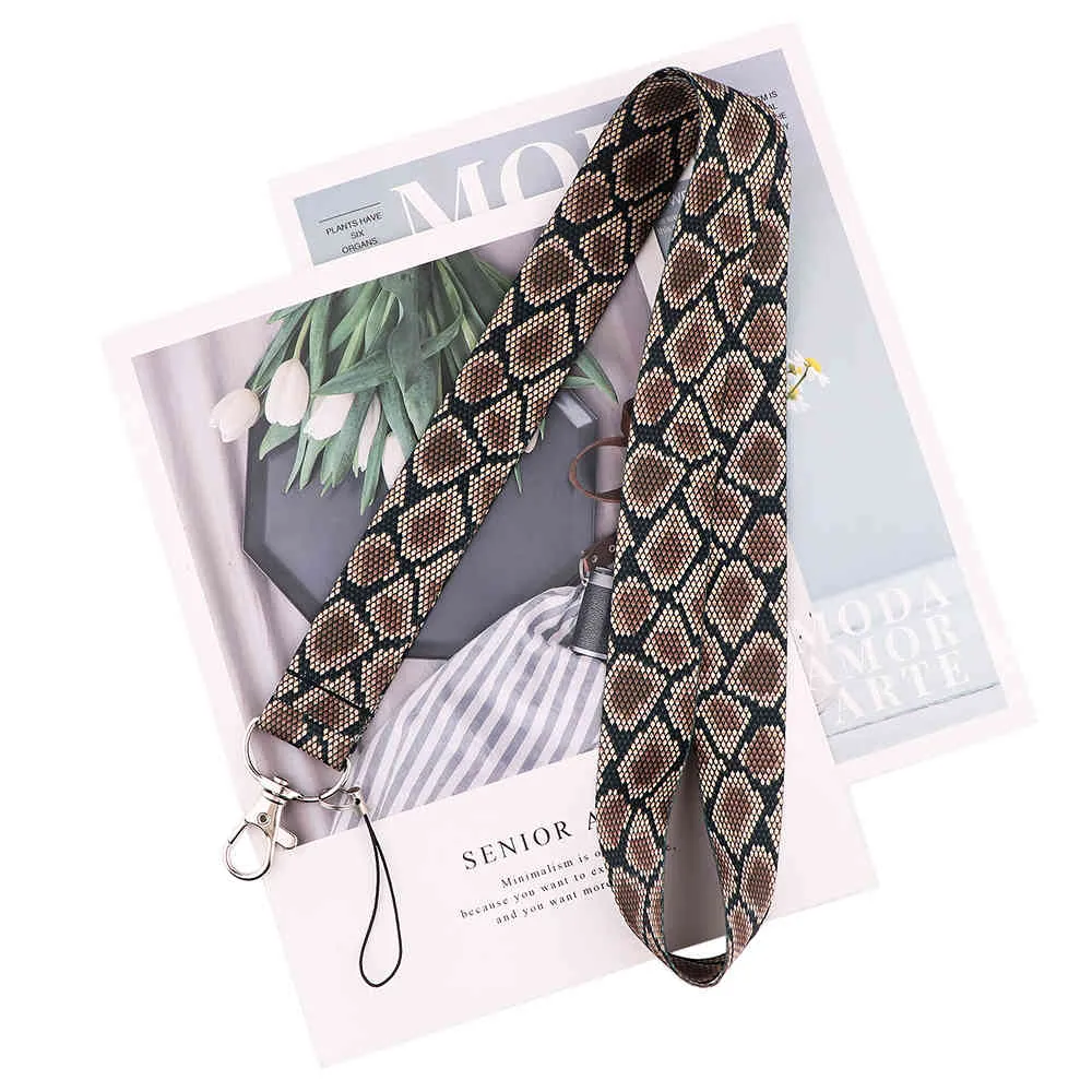 10 unids/lote J2612 estilo de piel llaveros insignia ID teléfono llave cordón cuello correas accesorios para amantes de las serpientes