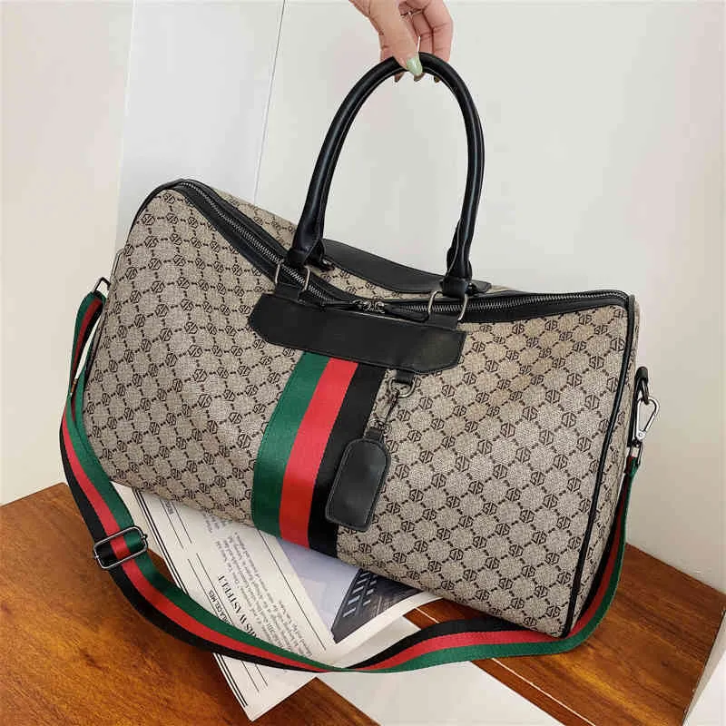 2022 fábrica inteira bolsa de moda tote viagem das mulheres dos homens couro masculino sacos ombro negócios em relevo bagage264c