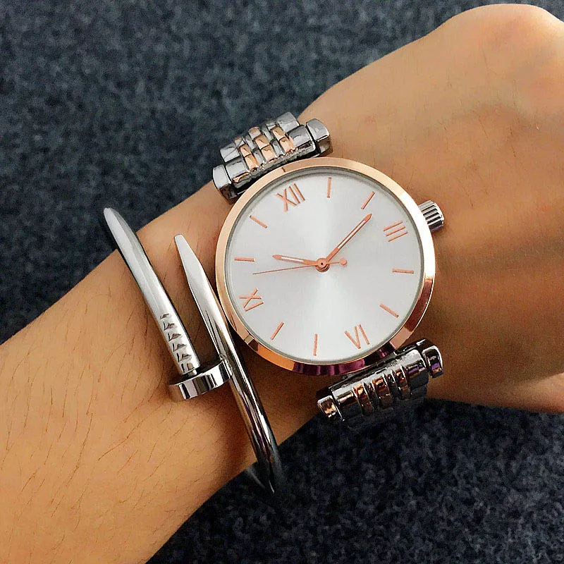 Montres de marque de mode femmes fille style bande d'acier en métal montre-bracelet à Quartz AR01