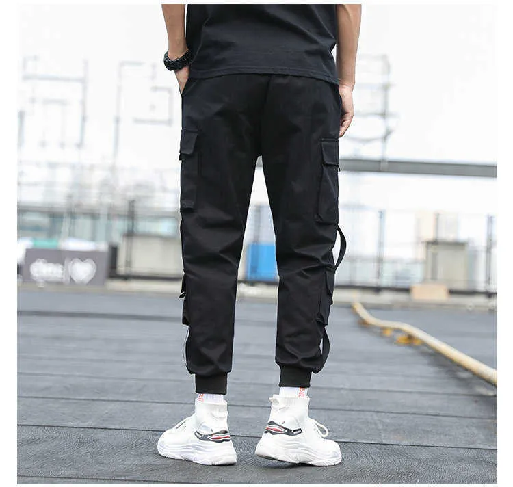 Tasche laterali da uomo Cargo Harem Pants Nuovi nastri Hip Hop nero Pantaloni da jogging maschili casuali Pantaloni casual streetwear di moda Y0811