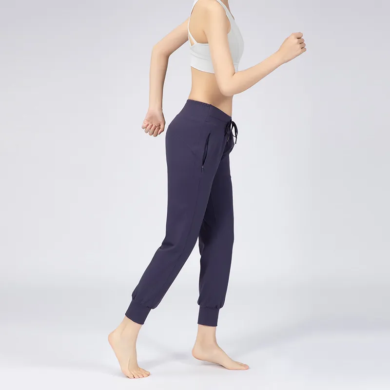 Pantaloni da jogging fitness a vita alta Pantaloni da yoga Pantaloni sportivi da allenamento elasticizzati da donna con due tasche laterali
