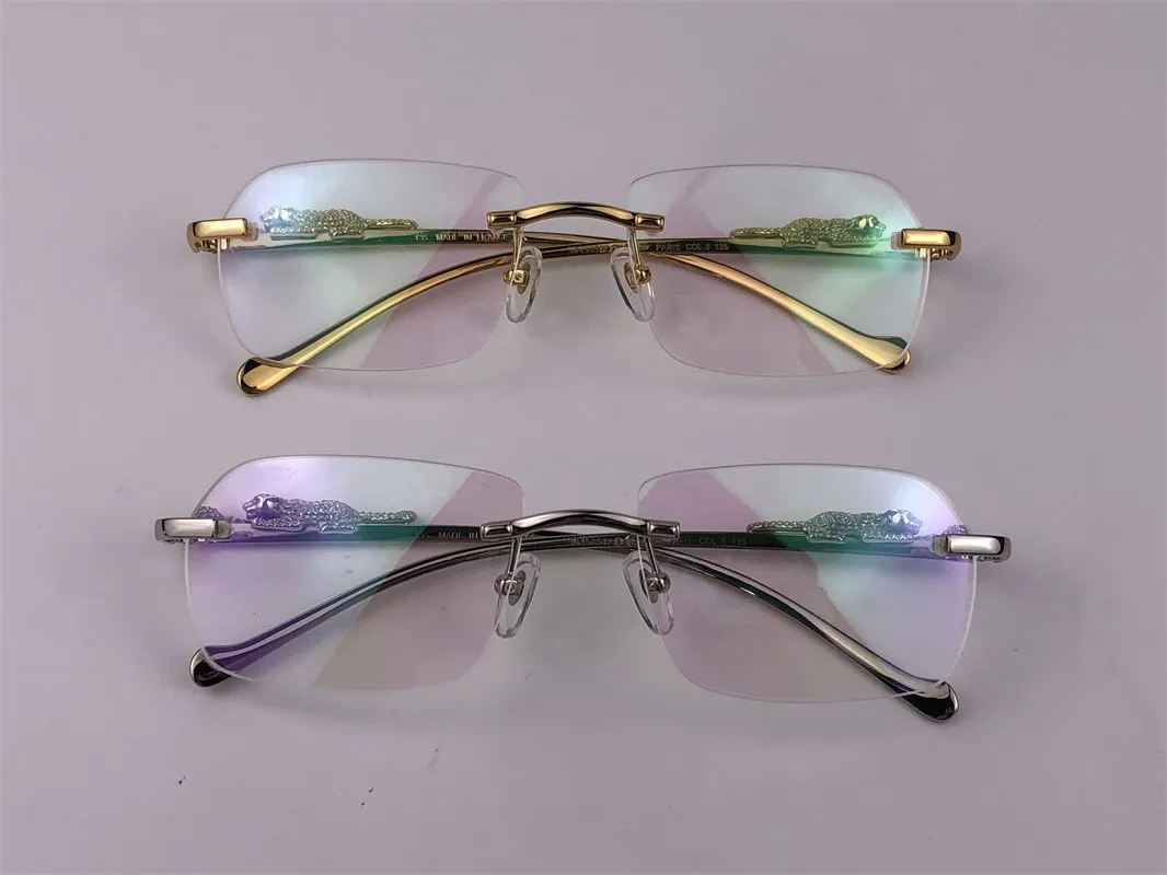 Ny modedesign Optiska ramglasögon 36456512 Liten oregelbunden ramfri transparent kristallskurna lins djurben retro klassiker209u