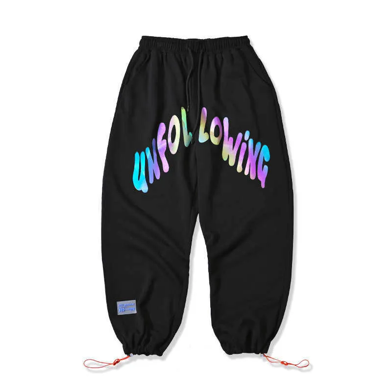 Spodnie dresowe Mężczyźni Hip Hop Colorful Reflectled Arc English Drukowane Hip Hop Harem Pant Streetwear Mężczyźni Joggers Pantalones Hombre 210527