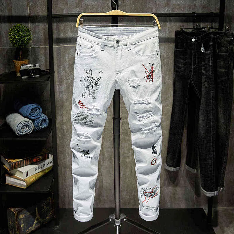 Mężczyźni Streetwear Osobowość Riped Drukowane Białe Chude Dżinsy Hip Hop Punk Casual Motorcycle Stretch Denim Dżinsy Spodnie 211111