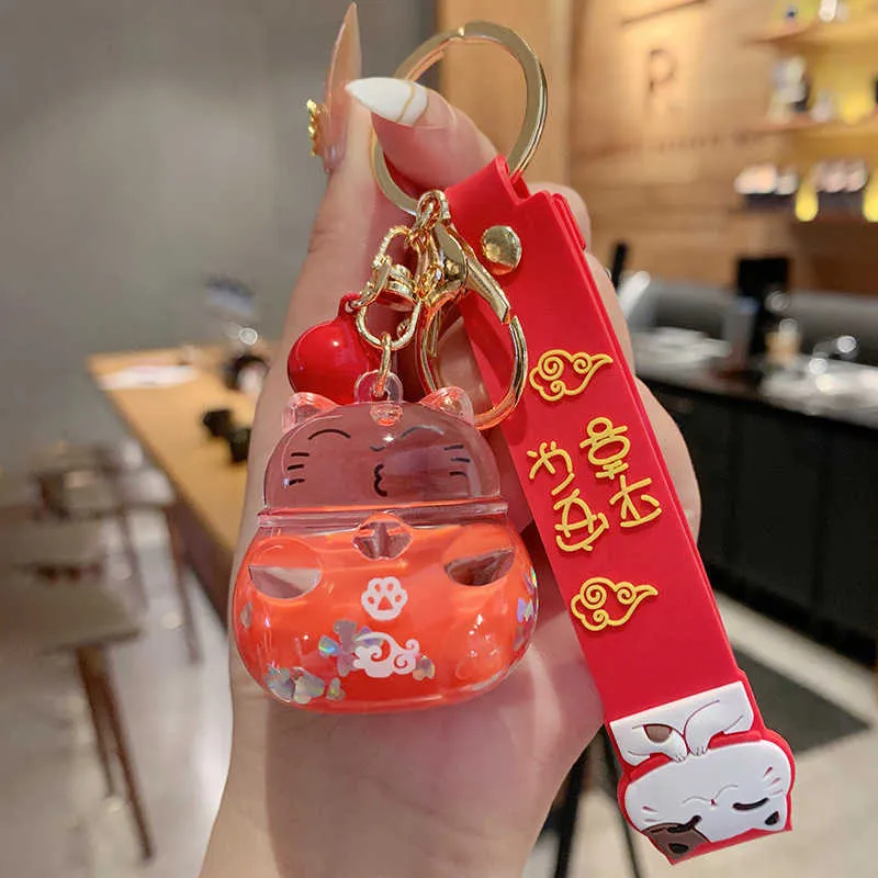 Creative Fashion Lucky Cat Transparent Floating Bottle Keychain Female Cute Acrylic Doll Nyckelringbil Pendant Smycken Gift G10199112547