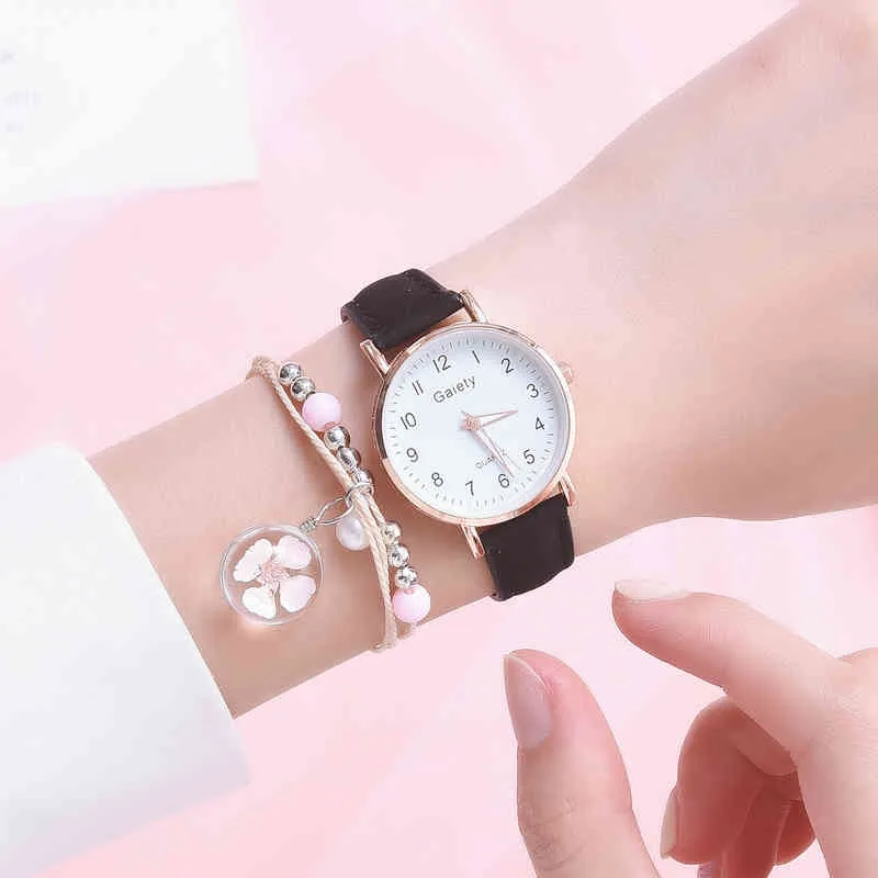 Modehorloge + armband dames nieuwe quartz set meisjes wilde zwarte riem ronde en roze hanger