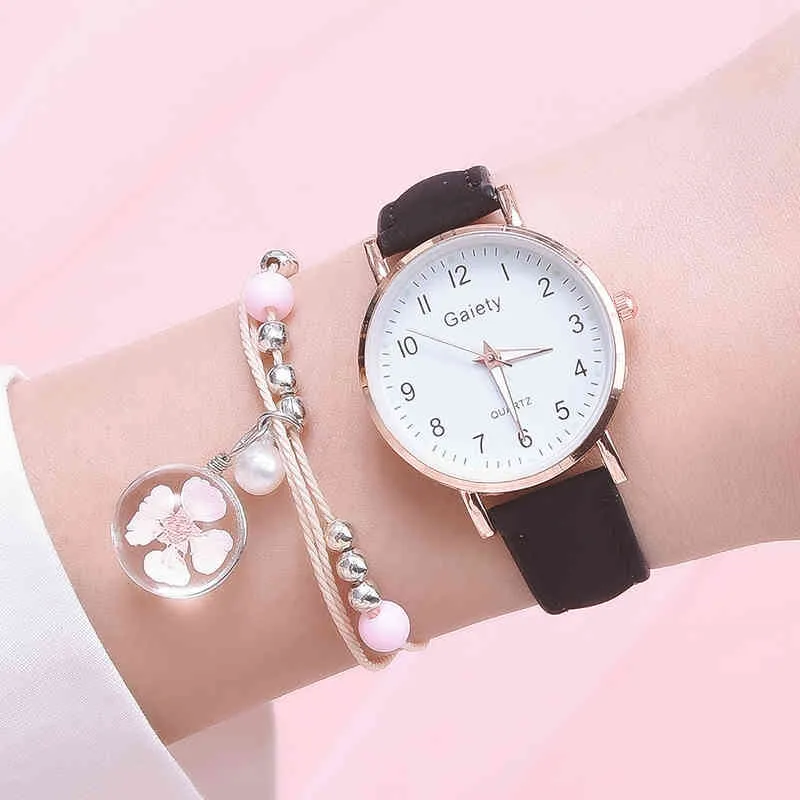 Modehorloge + armband dames nieuwe quartz set meisjes wilde zwarte riem ronde en roze hanger