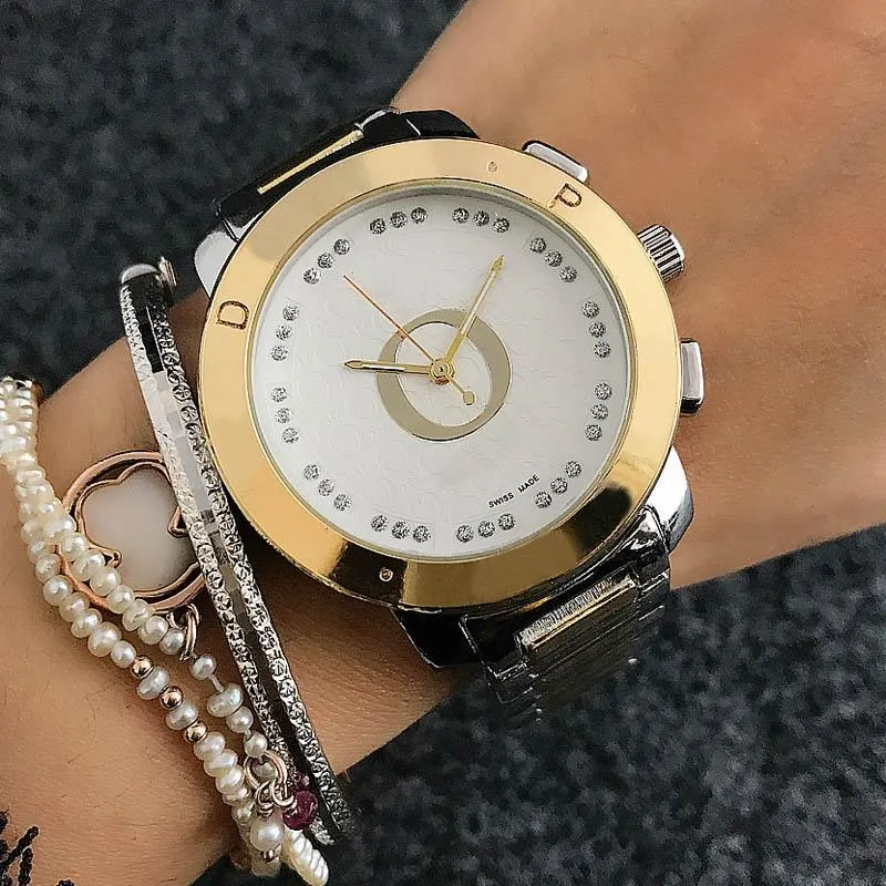 Marque de mode montres femmes dames fille cristal grandes lettres Style métal acier bande Quartz montre-bracelet cadeau populaire durable assez charmant