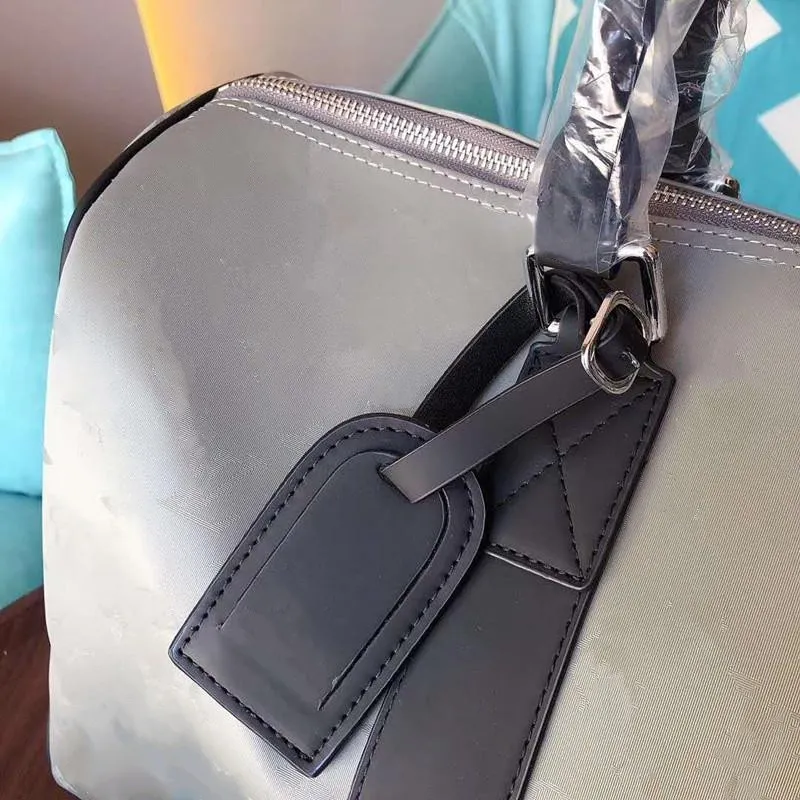 Bolsa de viaje de equipaje Aleación de titanio 47 cm Hold-All M44170 Bolsos de manejo de lona bolsos de diseñador Bolsos de diseñador de hombres Mochilas de mochila Handba337w