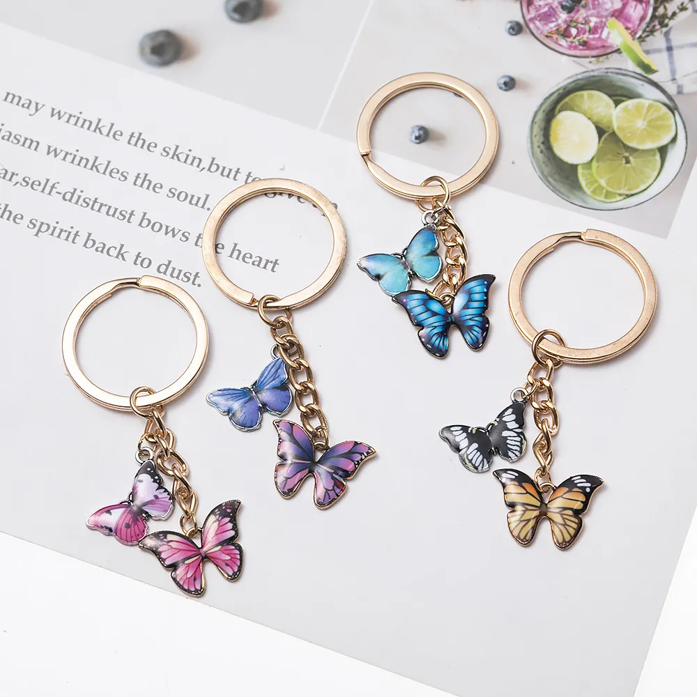 Dubbel färgglada fjäril nyckelring ringhållare charm mode enkel insekt nyckelring väska hängsmycke smycken