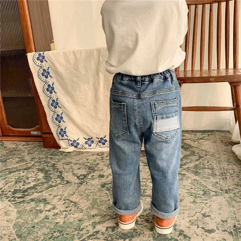 Printemps unisexe enfants élastique jeans déchirés style coréen garçons et filles pantalons en denim droit en vrac 210615