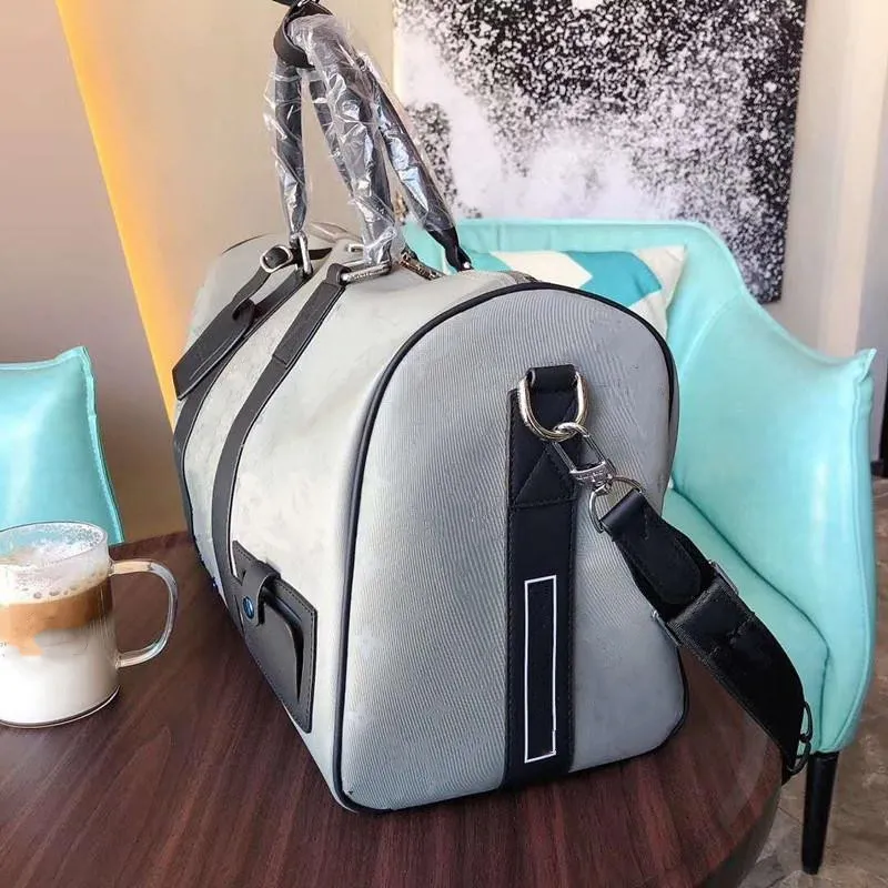 Bolsa de viaje de equipaje Aleación de titanio 47 cm Hold-All M44170 Bolsos de manejo de lona bolsos de diseñador Bolsos de diseñador de hombres Mochilas de mochila Handba337w