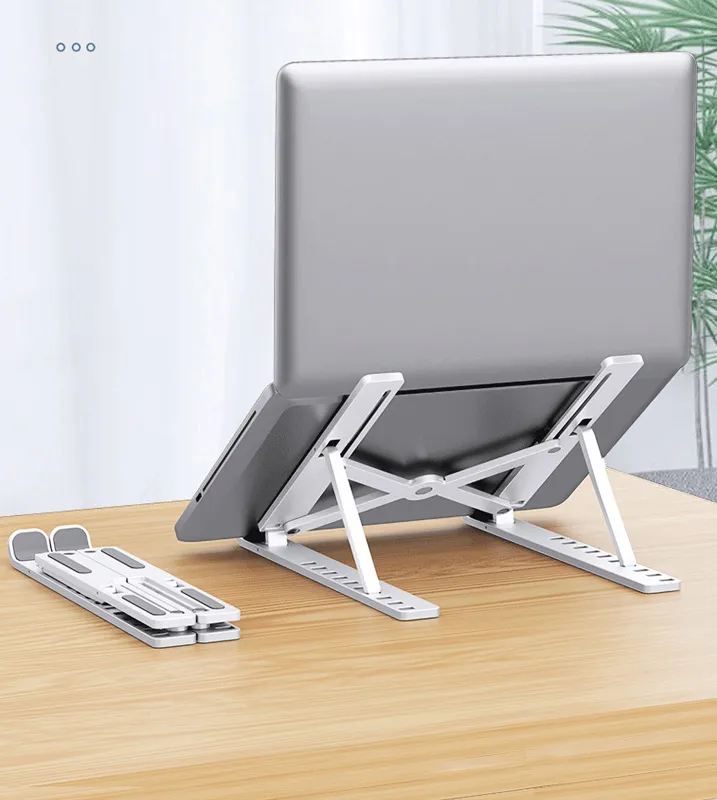 Kreatywne przenośne stojaki laptopa Składane wsparcie podstawowe Notebook Stojamy na MacBook Pro Lapdesk Pieczelnik komputerowy Współ