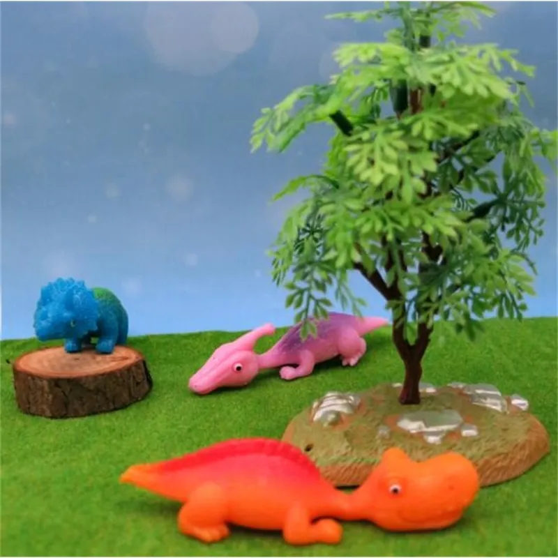 Kapsel kleiner Mini -Vending Funny SPAY Catapult Flying Squeeze Dino Weiche Plastik TPR Slings Dinosaurierspielzeug Spielzeug für Kinder 2021272t3932736